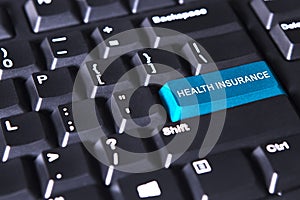 Text of health insurance on the keyboard