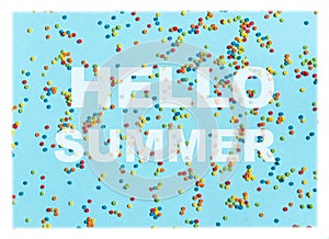 Text Hello summer on blue bsckground with colorful dots. Bright and positive.