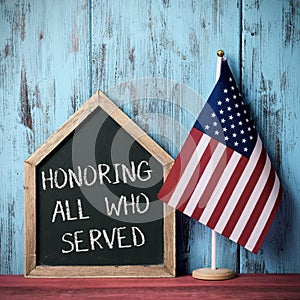 Text honoring all who served and american flag