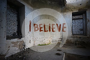Text i believe on the dirty old wall in an abandoned house