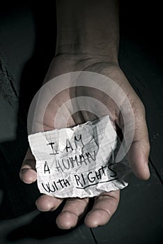 Text I am a human with rights in a piece of paper