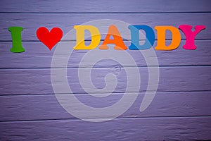 Text `I love daddy` of colorful paper alphabet