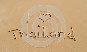 Text 'I love Thailand' in the sand