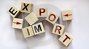 Text Import, export and pointers written on wooden blocks and white background