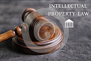 Text Intellectual Property Law near judge`s gavel on background