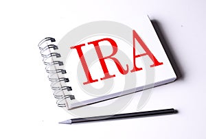 Text IRA on notebook on the white background, business