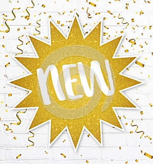 Text label new in golden glitter star with confetti on backgroun