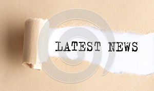 The text LAST NEWS appears on torn paper on white background