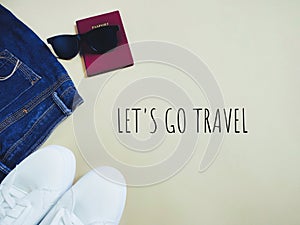Text LET'S GO TRAVEL in vintage background. Stock photo.