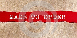 The text Made to order appearing behind torn paper. business