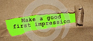The text Make a good first impression appearing behind torn brown paper