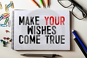 Text make your dream come true on the short note texture background.