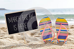 Text march break is here on the beach