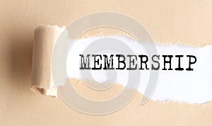 The text MEMBERSHIP appears on torn paper on white background