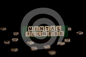 Text `mental illness` on uppercase letters photo