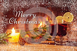 Text Merry Christmas on the background of a beautiful image with mulled wine and a fireplace. Romantic Christmas Card