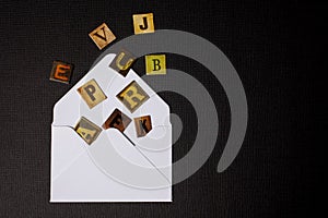 Text, message, letters scattered in white envelope