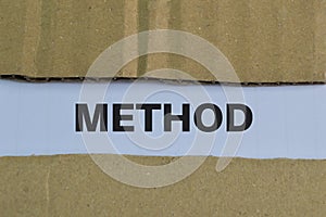 Text METHOD written on a white background. Top view