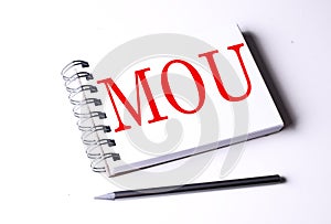 Text MOU on notebook on the white background, business photo