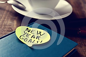 Text new years goals in a notepad photo