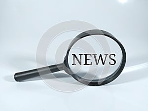 Text NEWS in black word with magnifying glass on white background.