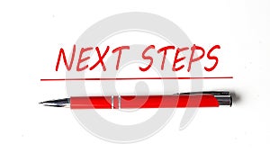 Text NEXT STEPS with ped pen on the white background