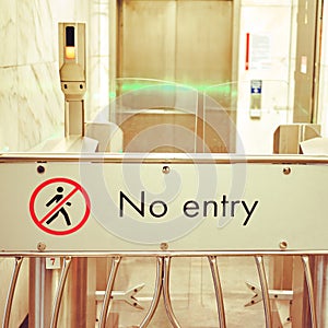 Text No entry and indoor the closed turnstile