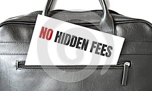 Text No Hidden Fees writing on white paper sheet in the black business bag. Business concept