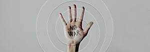 Text no war written in a hand, web banner