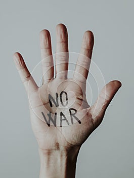 Text no war written in the palm of a mans hand