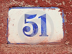 Text with number 51 on the wall photo