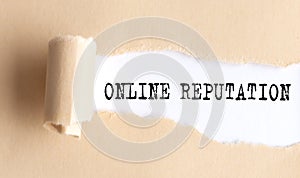 The text ONLINE REPUTATION appears on torn paper on white background