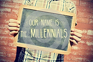 Text our name is the millennials in a chalkboard, vignetted photo