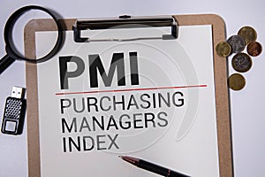 Text PMI on wood cube lay on chart candle document paper , economic data concept photo