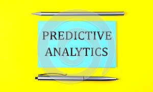 Text Predictive Analytics on the blue sticker on yellow background