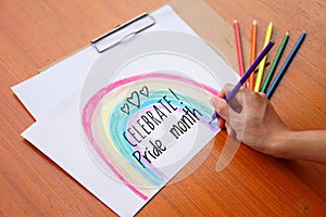 Text  Pride month Lgbtq+ on hand drawing rainbow picture drawing color pencils