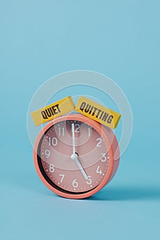 text quiet quitting and pink clock