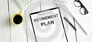 Text Retirement Plan is on the white paper with coffee  calculator and ball