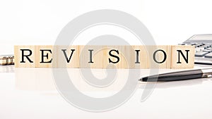 Text Revise from wooden letterson on white background