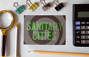 text Sanitary cities quote on notepad, concept background