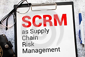 text SCRM as Supply Chain Risk Management on white paper