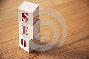 Text seo on a wooden cube blocks. SMM targeting copywriting web marketing concept