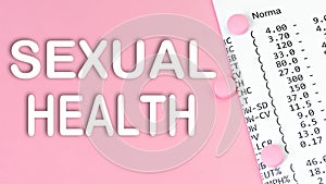 Text SEXUAL HEALTH on pink background, medical concept, top view