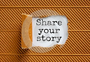 The text `share your story` appearing behind torn brown paper. Beautiful background. Business concept