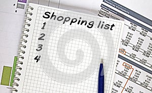 Text Shoping List. Financial planning on notebook