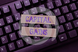 Text showing inspiration Capital Gains. Word Written on Bonds Shares Stocks Profit Income Tax Investment Funds Abstract