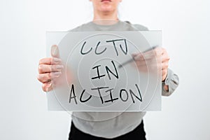 Text sign showing Cctv In Action. Internet Concept Selfcontained surveillance system comprising cameras Man With photo