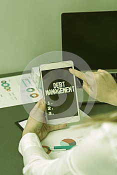 Text showing inspiration Debt ManagementThe formal agreement between a debtor and a creditor. Business idea The formal