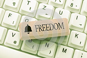 Text showing inspiration Freedom. Internet Concept liberty rather than in confinement or under physical restraint Typing