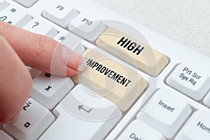 Text showing inspiration High Improvement. Concept meaning making yourself a better or more knowledgable person photo